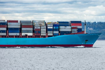 red-and-blue-cargo-ship-on-sea-during-daytime.jpg red and blue cargo ship on sea during daytime